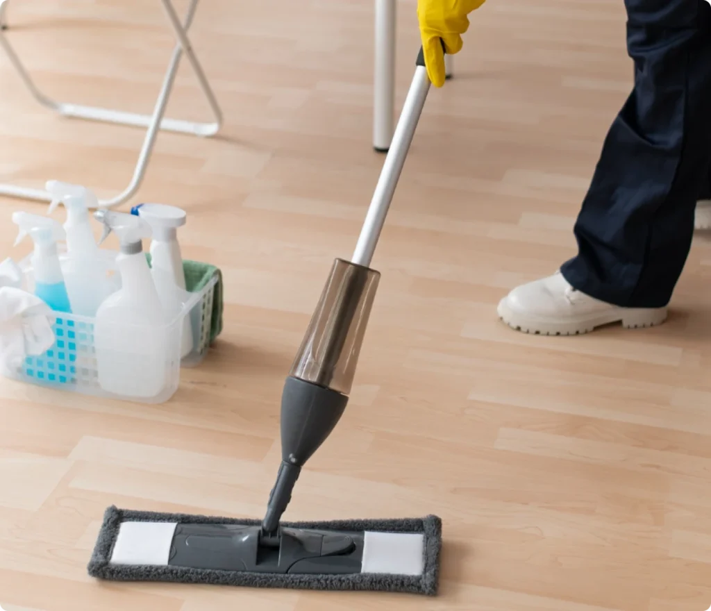 Janitorial staff with cleaning supplies maintaining a pristine office floor for Beeyond Facility Services' Commercial Cleaning clients in Washington, D.C. (Metro Center).