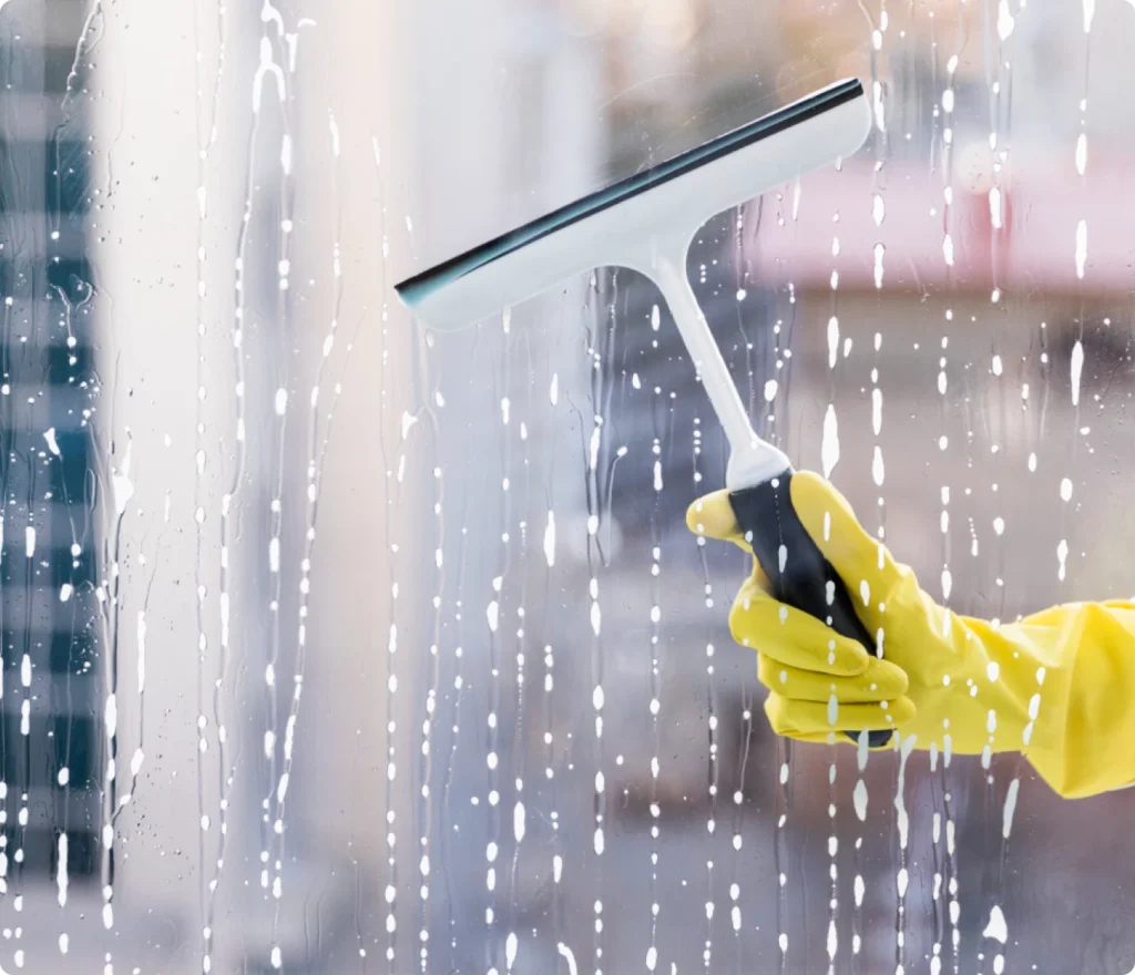 Close-up of streak-free window cleaning by Beeyond Facility Services, offering premium Commercial Cleaning in Washington, D.C. (Metro Center).
